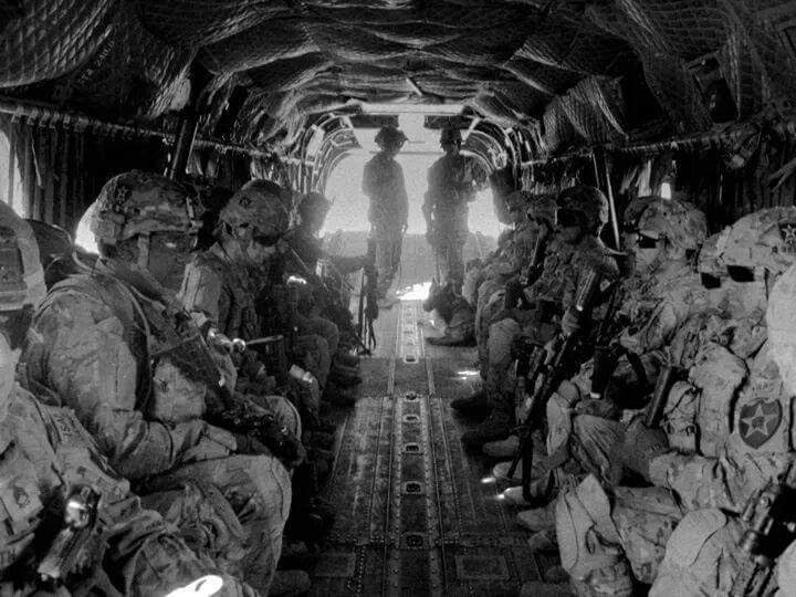 Soldiers aboard a Chinook helicopter