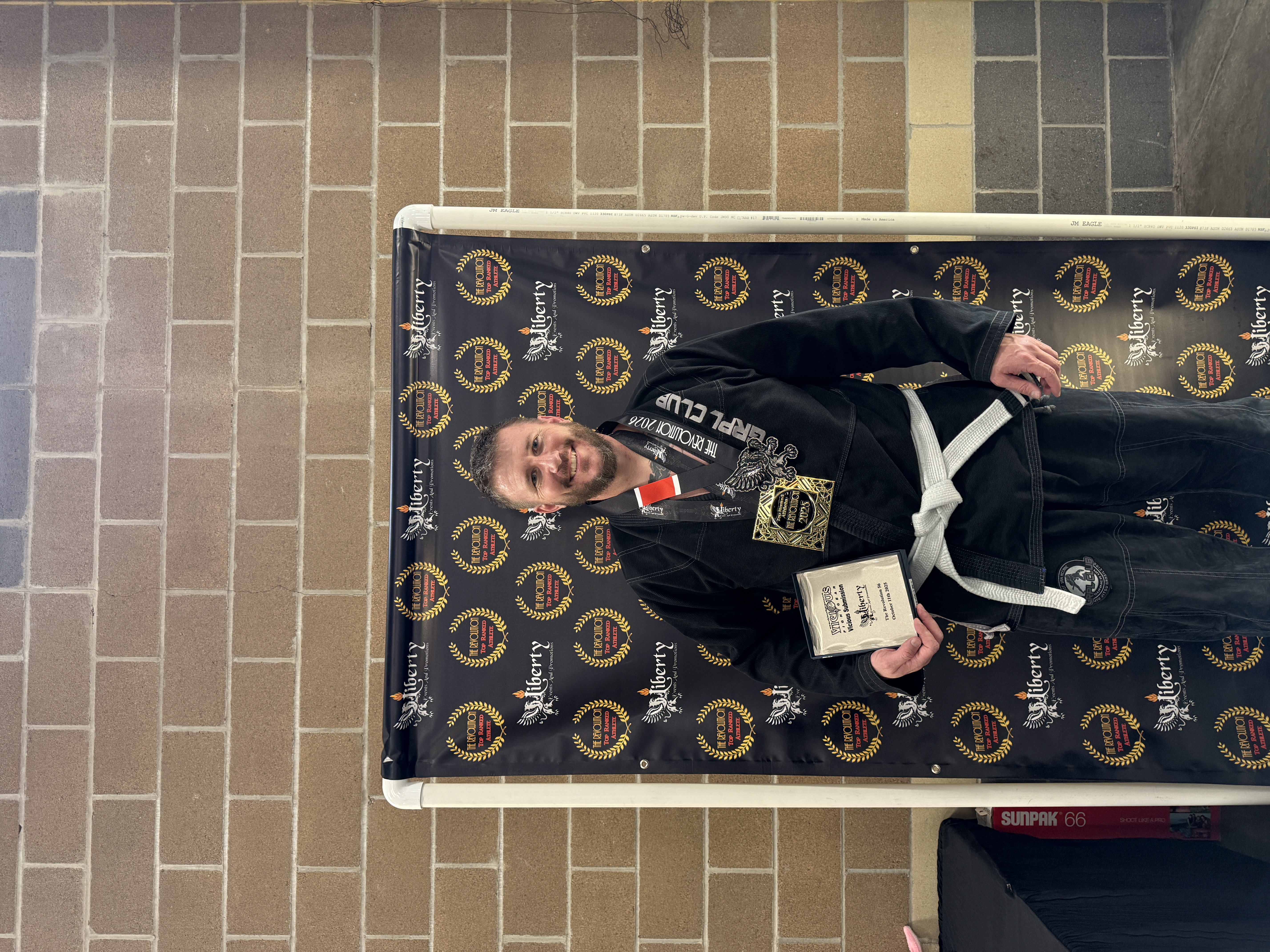 Founder with competition medal and award